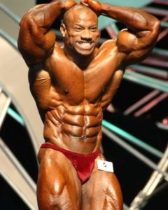 dexter jackson sul palco del Mister Olympia 2003 addome e gambe